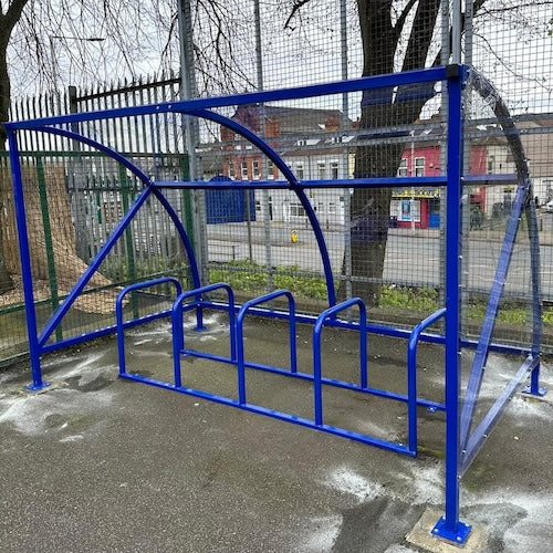 Curved cycle shelter called “The Rosie” featuring sleek curved roof and steel frame