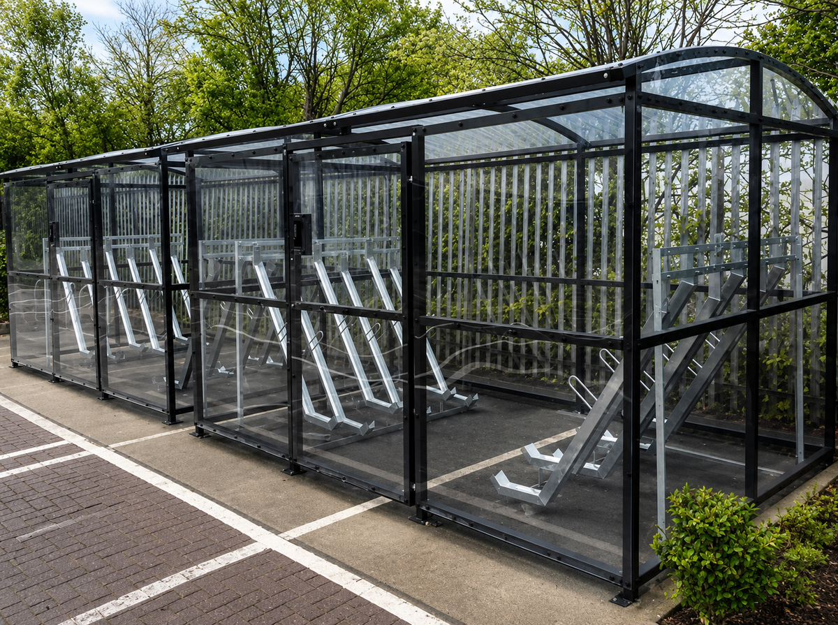 Commercial carriage cycle shelter installation with clear panels and galvanised cycle racks
