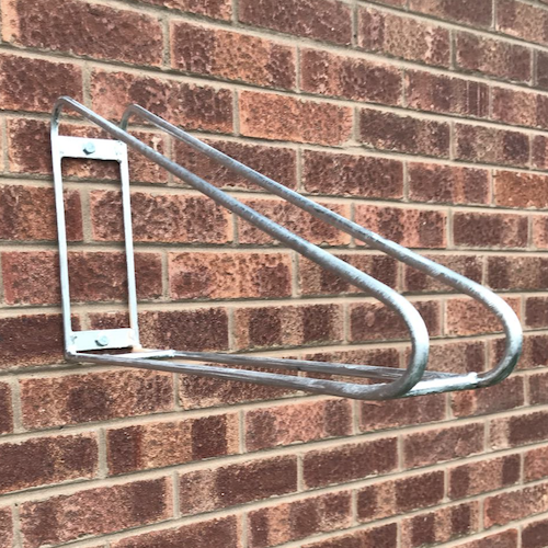 Wall Rack Pro vertical bike storage system installed in a bike room