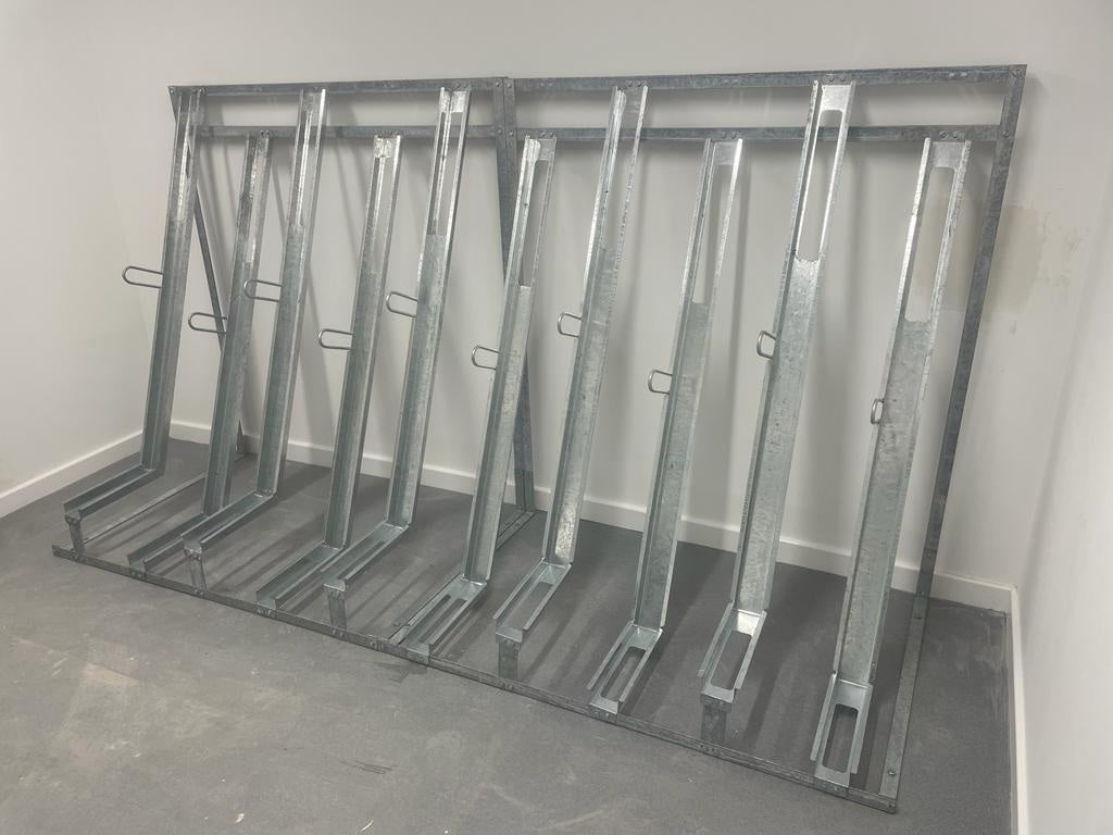 Semi-vertical bike racks installed in UK residential development bike room
